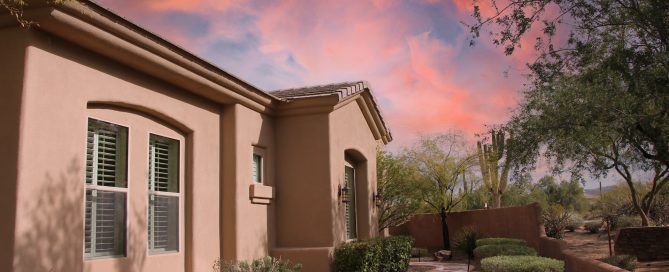 Stucco house with beautiful sky in the background - why does mold grow in my house
